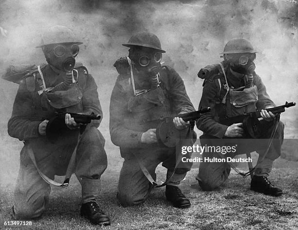 At Tommy Gun Practice. British soldiers at practice with Tommy guns from the USA these guns can be fired from the hip as well as the shoulder.