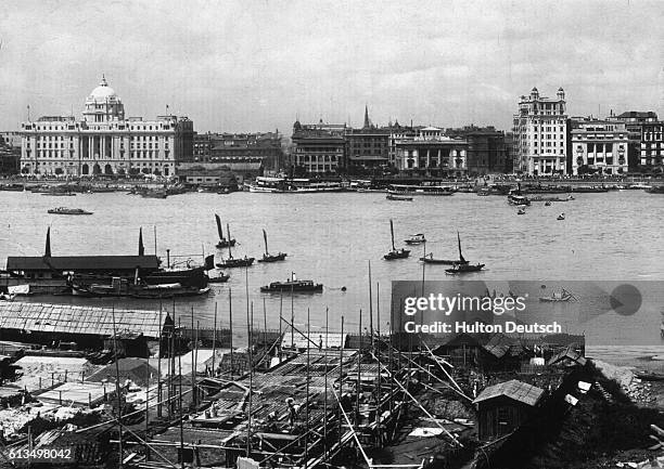 Building work underway on a bank of the Huangpu River.