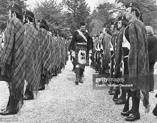 George Ian Murray, Duke of Atholl, inspects his troups, the Atholl Highlanders, during the 710th anniversary of Blair Castle.