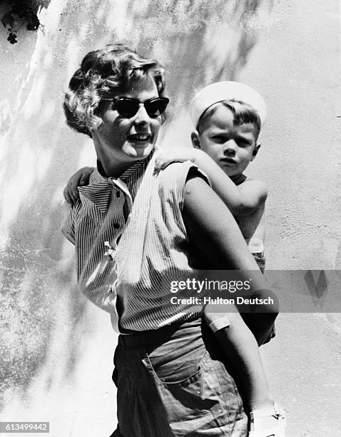 Swedish actress Ingrid Bergman gives her son Robertino Rossellini a piggyback, while on holiday in Portofino, Italy in 1952.