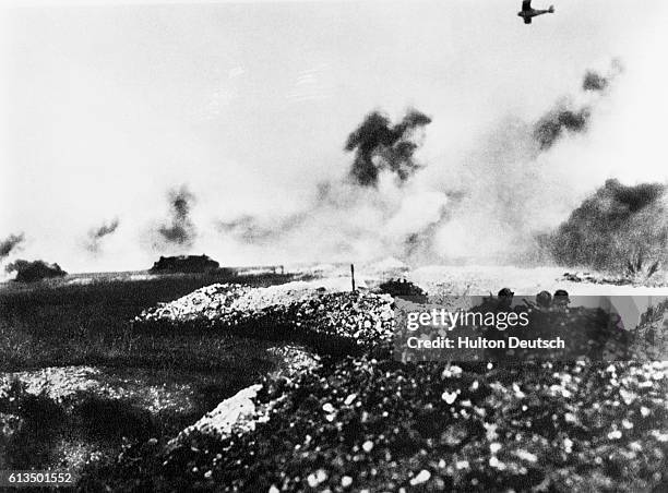 Tank and air battle in WW1. Tanks were few and unwieldly, planes were slow and no co-operation to speak of existed between tank and plane formations.