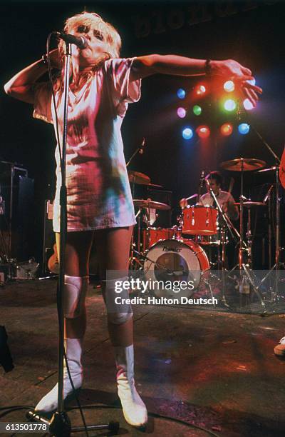 Debbie Harry, the American pop singer, actress and lead singer of the group 'Blondie', performing on stage.