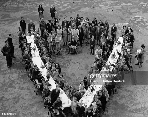 Victory Party For Children In South London. Children sat down to a Victory Party given by flat residents at Kentwell Close, Brockley in South London....