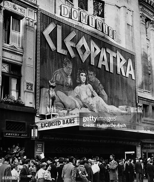 London filmgoers wait to enter the theater for the 1963 premiere of Cleopatra starring Elizabeth Taylor, Richard Burton, and Rex Harrison. |...