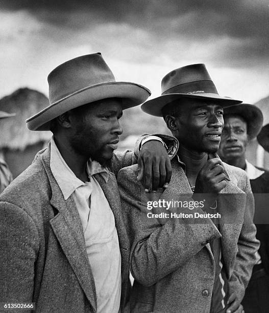 Identifiable by their budding beards, young teachers who support Seretse Khama, and who are in his regiment, attend a meeting in Serowe.