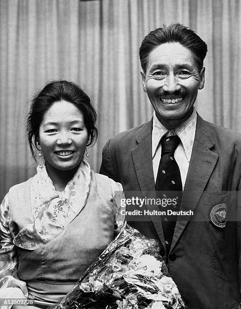 Sherpa Tenzing who successfully climbed Mount Everest with Sir Edmund Hillary in 1953, with his wife, after arriving in Britain for a reunion to...