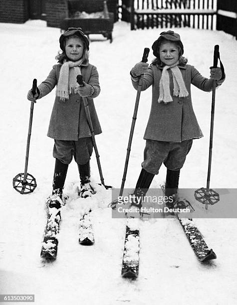 Four year old twins - Mary and Jean Walker - on skis.