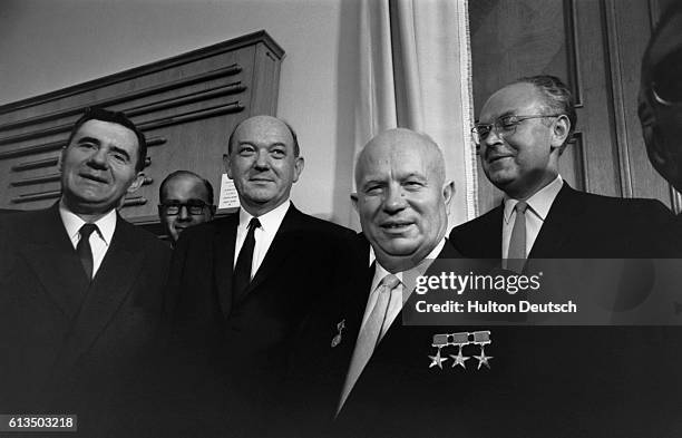 Soviet Foreign Minister Andrei Gromyko, Dean Rusk, and Soviet Premier Nikita Khrushchev, during the signing of the Nuclear Test Ban Treaty in the...