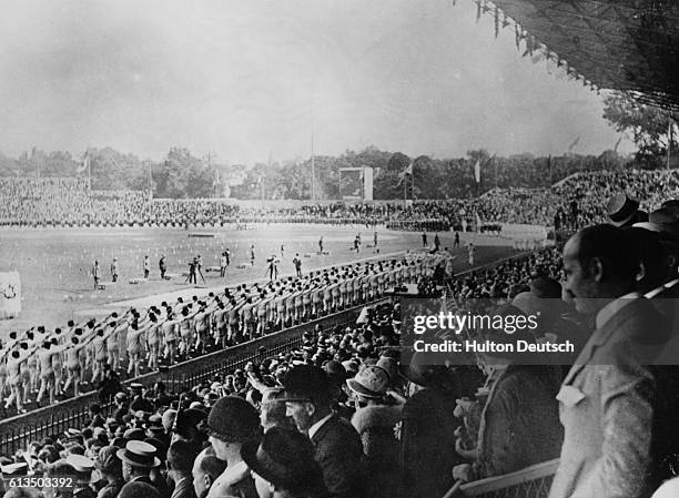 Large audience watches a ceremony at Colombes Stadium during the 1924 Olympiad at Paris, France. | Location: Paris.