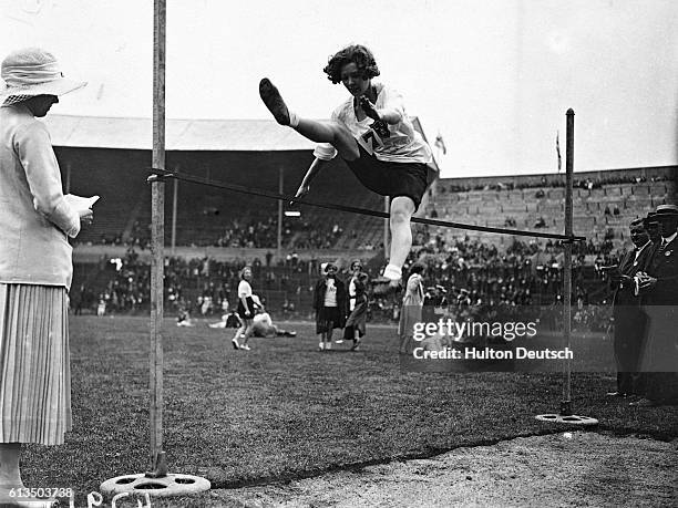 British Legion sports - Miss Hatt winning the high jump.