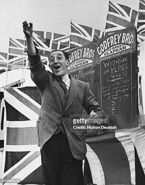 An excited bookie announcing the odds at the first Derby meeting in Epsom, England since 1939.