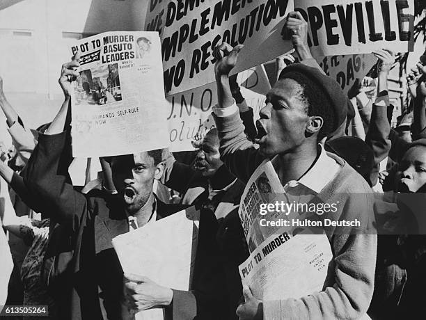 Two hundred and fifty South Africans and other non-Europeans demonstrate outside the hotel of Mr. Dag Hammarskjold, the Secretary-General of the...