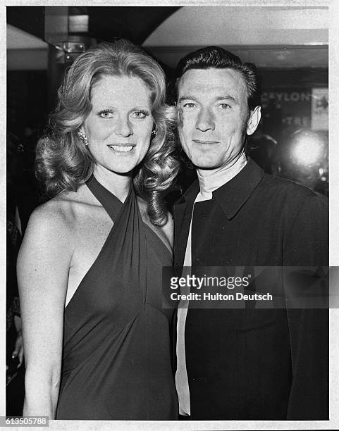 The actor Laurence Harvey arrives at the cinema in London for the premiere of the The Godfather with his companion, the model Pauline Stone, 1972.