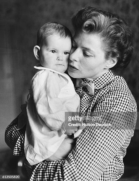 Swedish actress Ingrid Bergman, with one of her twin daughters, Isotta, in Naples, Italy in 1953.