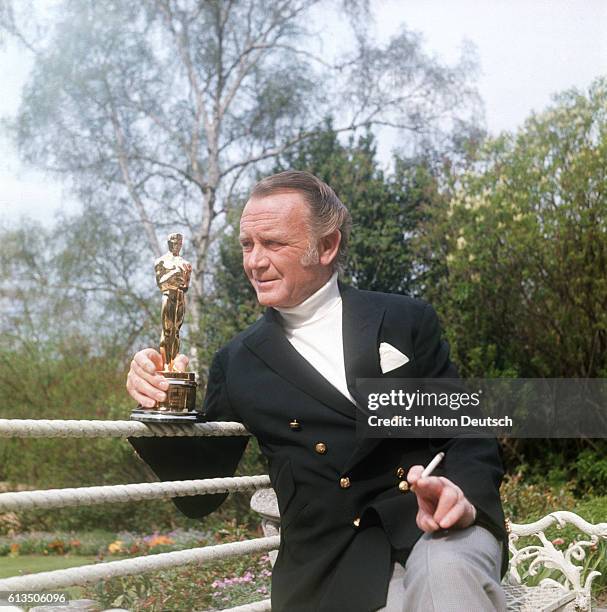 Actor John Mills with an 'Oscar' award for his part in the film Ryan's Daughter, 1971.