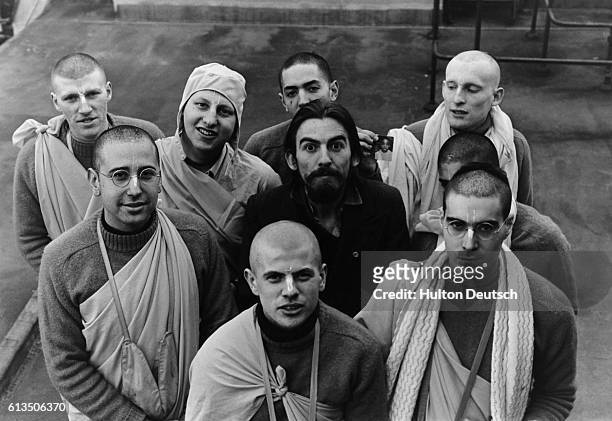 Ex-Beatle George Harrison with his friends from the Hare Krishna Temple with whom he has just made a second record.