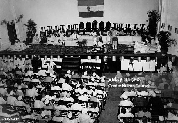 Incoming All India Congress Party President Jawaharlal Nehru and outgoing President Maulana Azad speak before delegates at a meeting in Bombay.