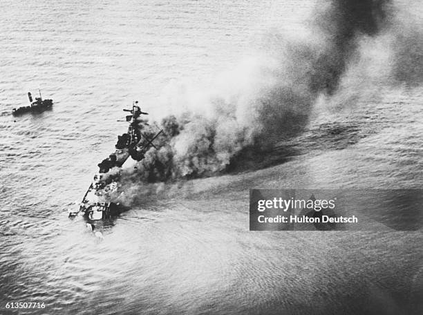 The battleship Admiral 'Graf Spee' breaks up as it burns and sinks to the bottom of the river Plate.