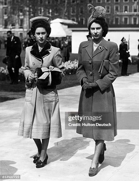 Their royal highnesses Princess Margaret and Princess Elizabeth walk side by side after leaving the unveiling ceremonies of the memorial statue to...