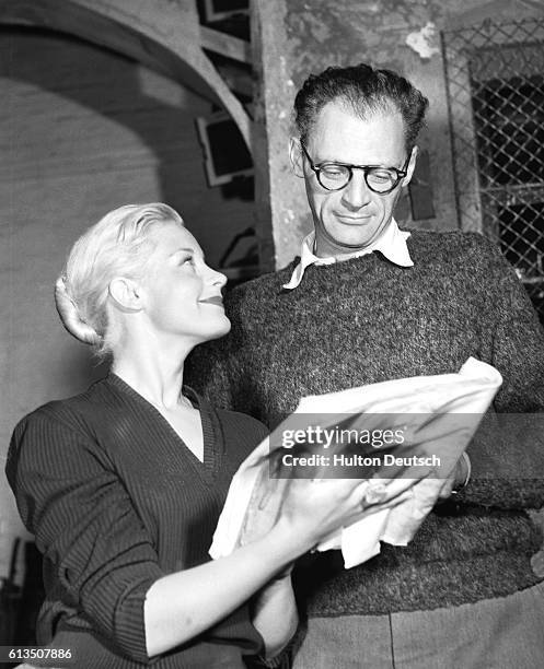 The American playwright Arthur Miller with the actress Mary Ure, at the rehearsals for his play A View from the Bridge at the Comedy Theatre, 1956.