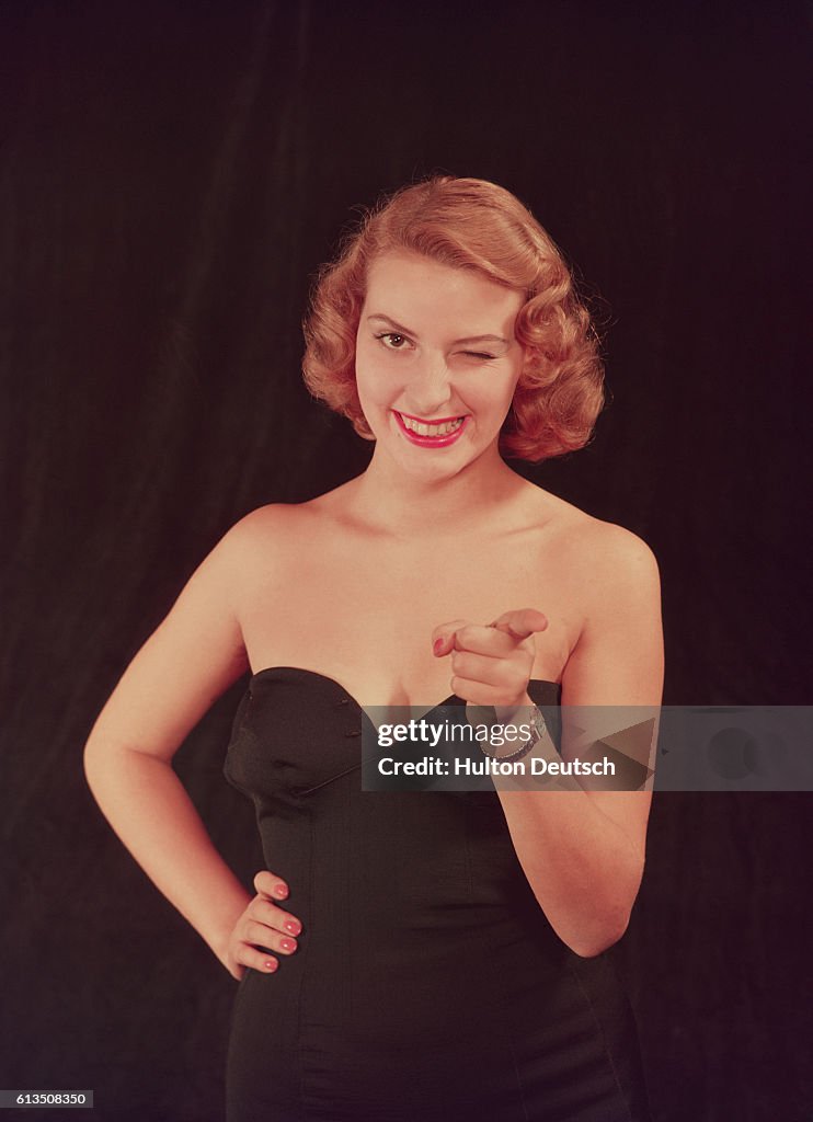 Winking Model in a Black Strapless Dress