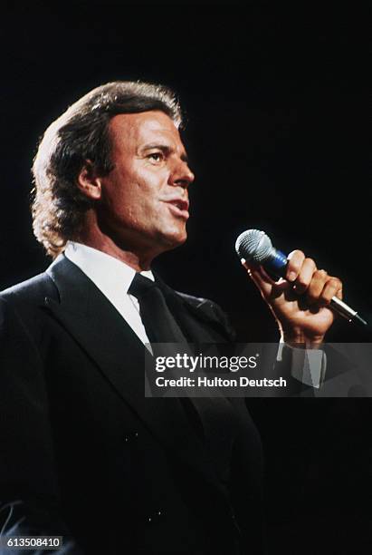 Singer Julio Iglesias at the Royal Albert Hall. Julio Iglesias, the Spanish international singing star, performing on stage at the Royal Albert Hall...