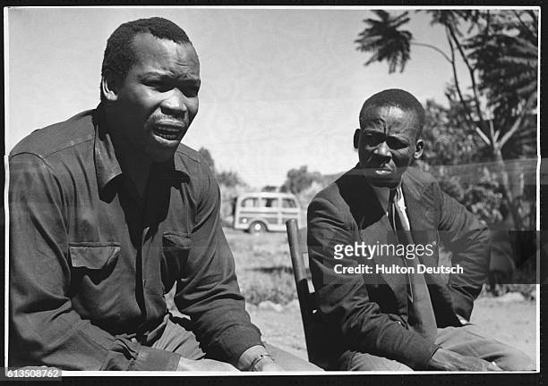 Seretse Khama the President of Bechuanaland, renamed Botswana after gaining independence, sits with a tribesman, 1950.