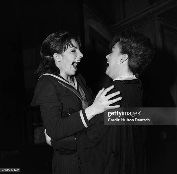 Judy and Liza. American singer and actress Judy Garland greeting her daughter, actress and singer Liza Minnelli, 1965. Garland; Judy: American...