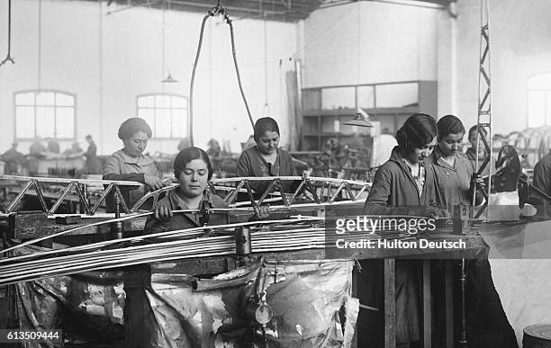Women constructing aeroplanes, Spain, 1920s.