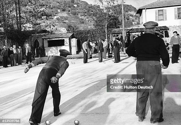 Frenchmen play boule in Villefranche-sur-Mer, France.