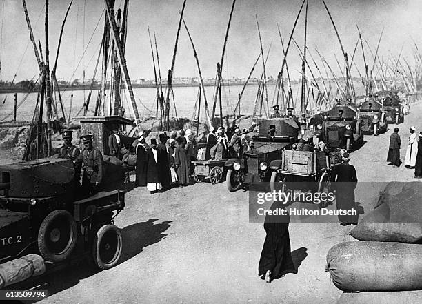 British military convoy drives along the Nile River in Cairo.