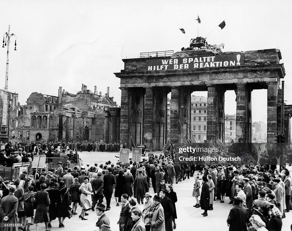 Communist Demonstrators March Through the Brandenburg Gate