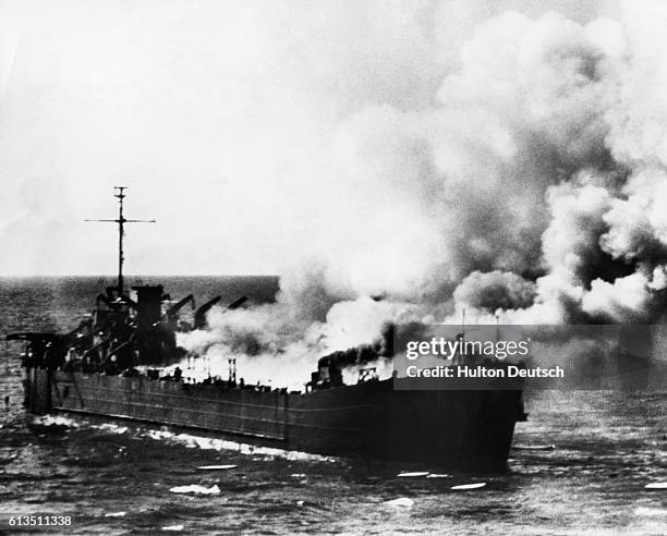Cargo ship used by the Irgun extremist force burns in the waters near Tel Aviv-Yafo. The group was trying to run a shipment of arms on shore in...