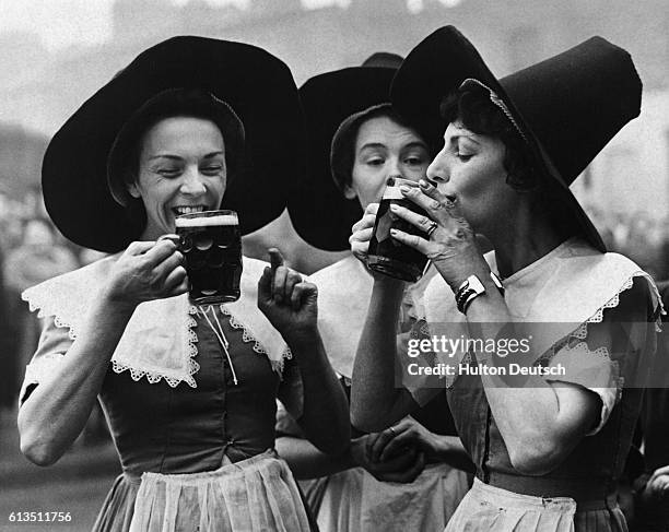 Barmaids in costume from the Festival Inn, East London, which is being built as part of the 1951 Festival of Britain. The Inn will be a live...