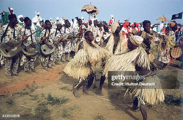 Dancers celebrate the Queen of England's visit to Nigeria during Durbar celebration. Durbar is a traditional dance and parade featuring the...
