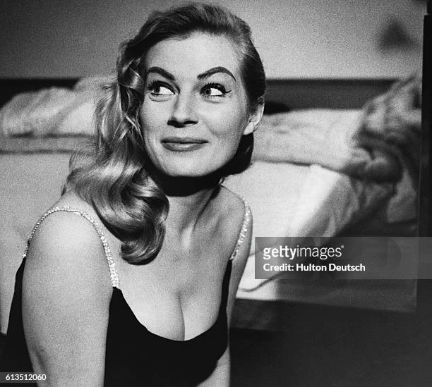 Anita Ekberg, Swedish film actress, in a room at the Savoy Hotel, 1955.