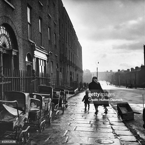 Mother and Children on Empty Street