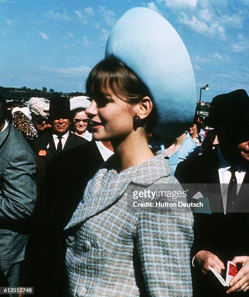 Jean Shrimpton, the English fashion model and international figure of the 1960s, mingles with the crowds attending the Melbourne Cup horse race.