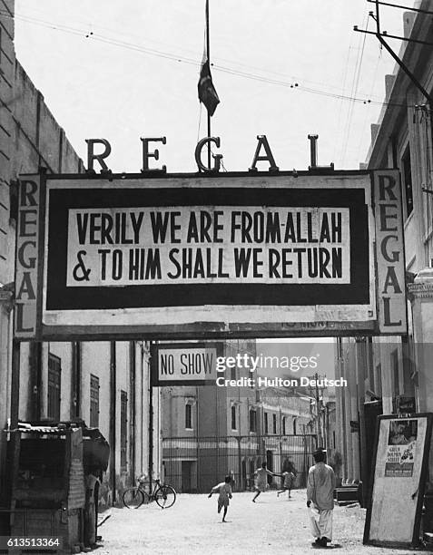 Flag flies at half-mast over the main notice board of the Regal cinema in Lahore, Pakistan, while the country mourns the death of Mohammad Ali...