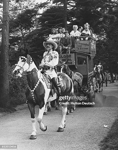 The Chessington Zoo Circus, led by 'Buffalo Bill' on horseback, travel from the Zoo to a hospital in Epsom to give a special show for the patients.