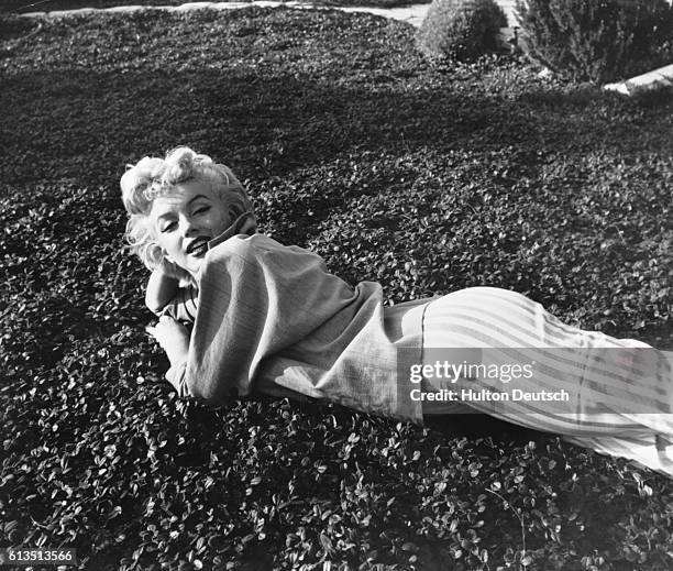 American film actress Marilyn Monroe photographed by English photographer Baron in Palm Springs, California in 1954. Baron is chiefly known for his...