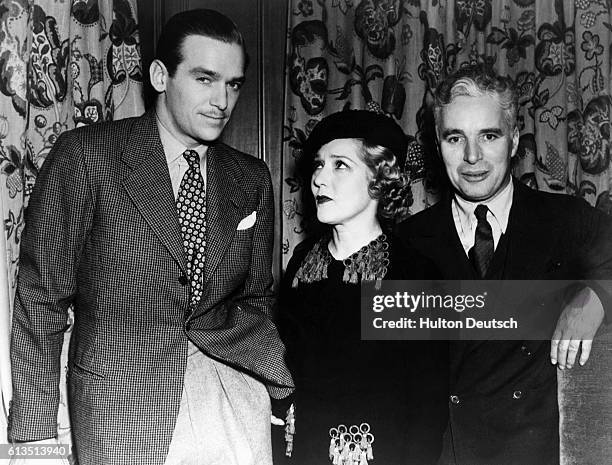 Douglas Fairbanks Junior with his stepmother, Mary Pickford and Charlie Chaplin.