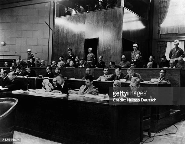 View of the defendants bench during a session of the International Crimes Tribunal in Tokyo, Japan. The third man to the right of the military...