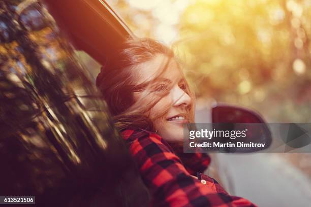 woman on a road trip with car - autumn car stock pictures, royalty-free photos & images