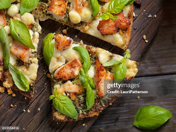 grilled chicken with basil pesto sauce and goat cheese - flatbread pizza stock pictures, royalty-free photos & images