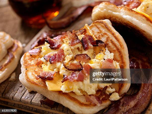 pancake breakfast taco with scrambled eggs, bacon and cheese - flatbread stock pictures, royalty-free photos & images