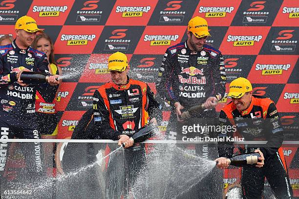 Nick Percat and Cameron McConville drivers of the Lucas Dumbrell Motorsport Commodore VF celebrate on the podium after finishing third in the...