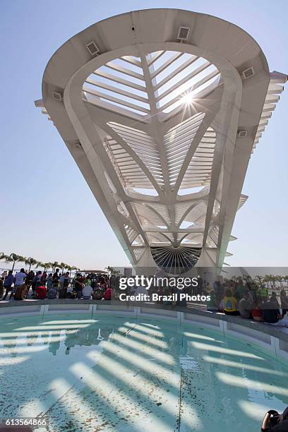 People enjoy the sunny day beside The Museum of Tomorrow at Pier Maua, next to the revitalized Praca Maua in Rio de Janeiro downtown, Brazil, a...