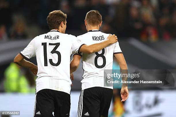 Toni Kroos of Germany celebrates scoring the 2nd goal with his team mate Thomas Mueller during the 2018 FIFA World Cup Qualifier match between...