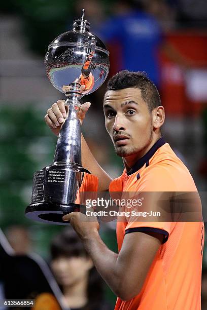 Nick Kyrgios of Australia gets surprised at the confetti cannon after winning the men's singles final match against David Goffin of Belgium on day...